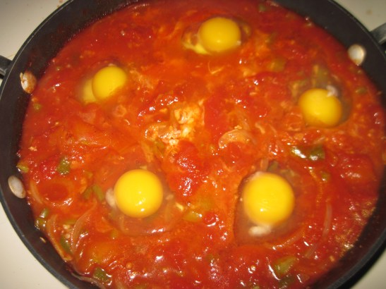 Make holes and drop in the eggs.